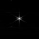 A bright light at center of this otherwise-black image is the star Webb is using to align its mirrors.